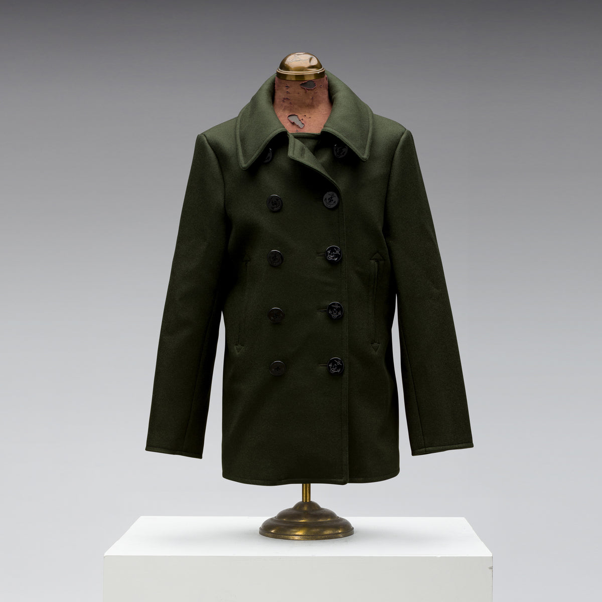 Black Bear Brand Peacoat in Hunter Green, front view, photographed in the studio.