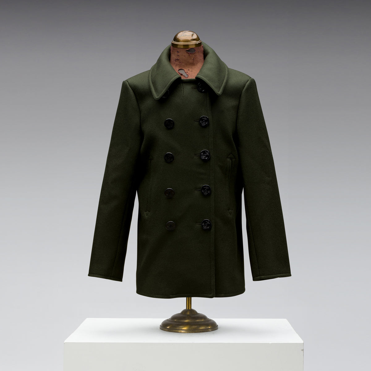 Black Bear Brand Peacoat in Hunter Green, front view, photographed in the studio.
