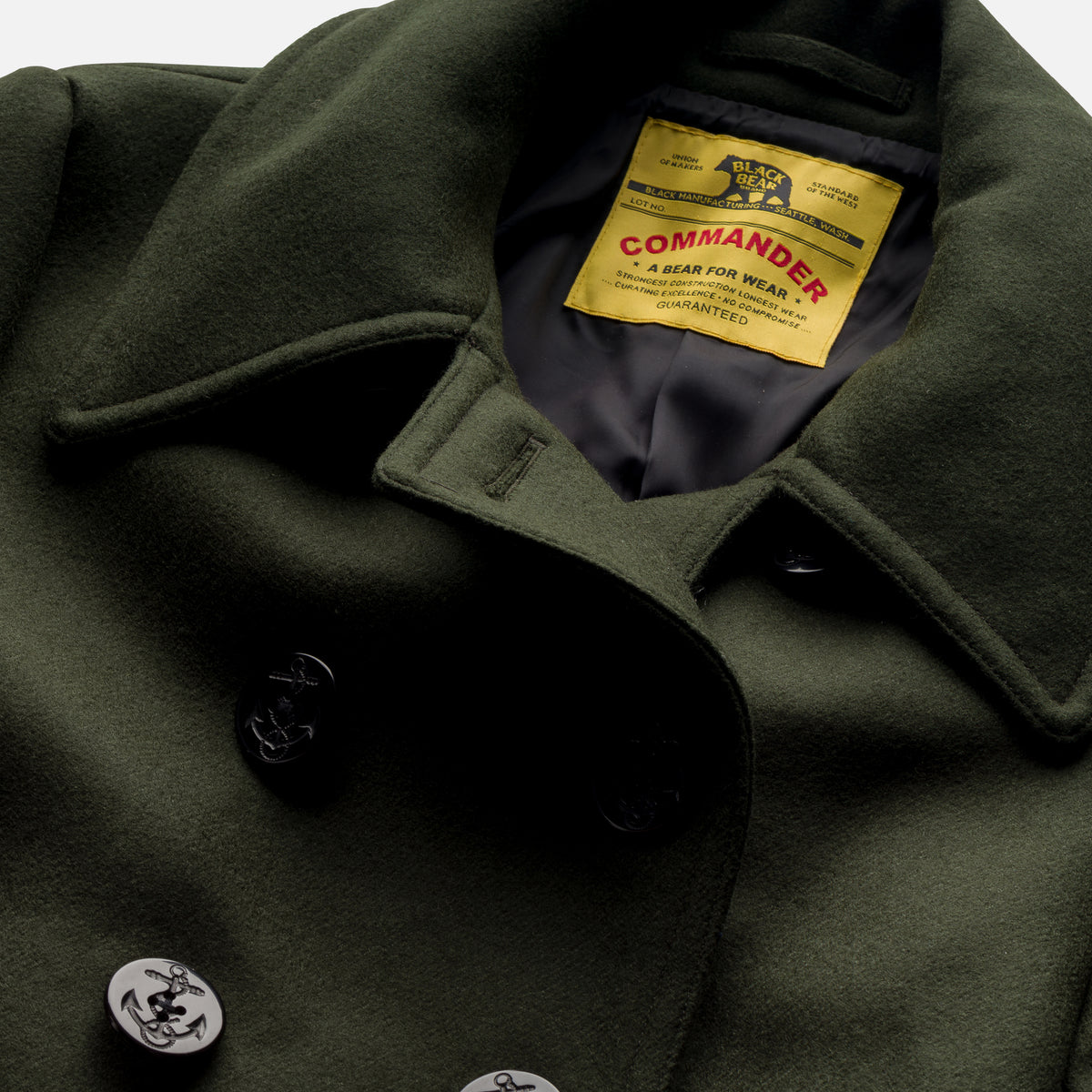 Detail view of the Black Bear Brand Hunter Green Peacoat’s double-breasted front and pockets.